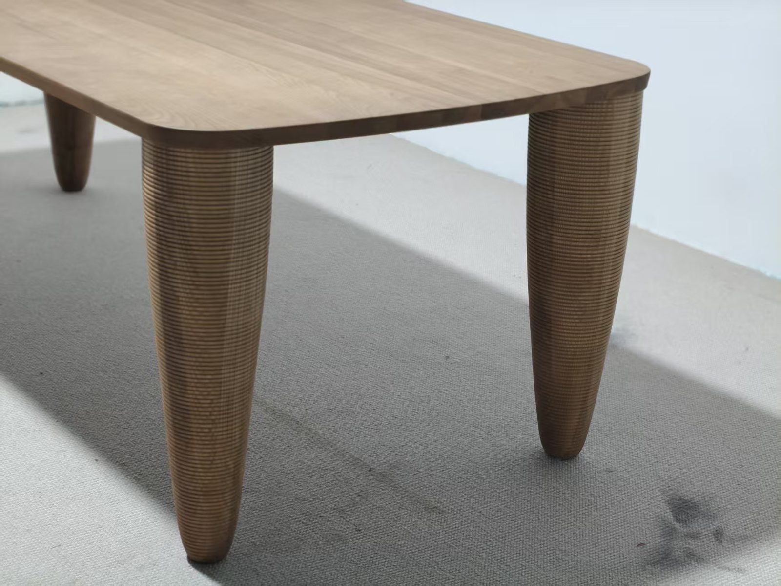 Dining table with mixed material base